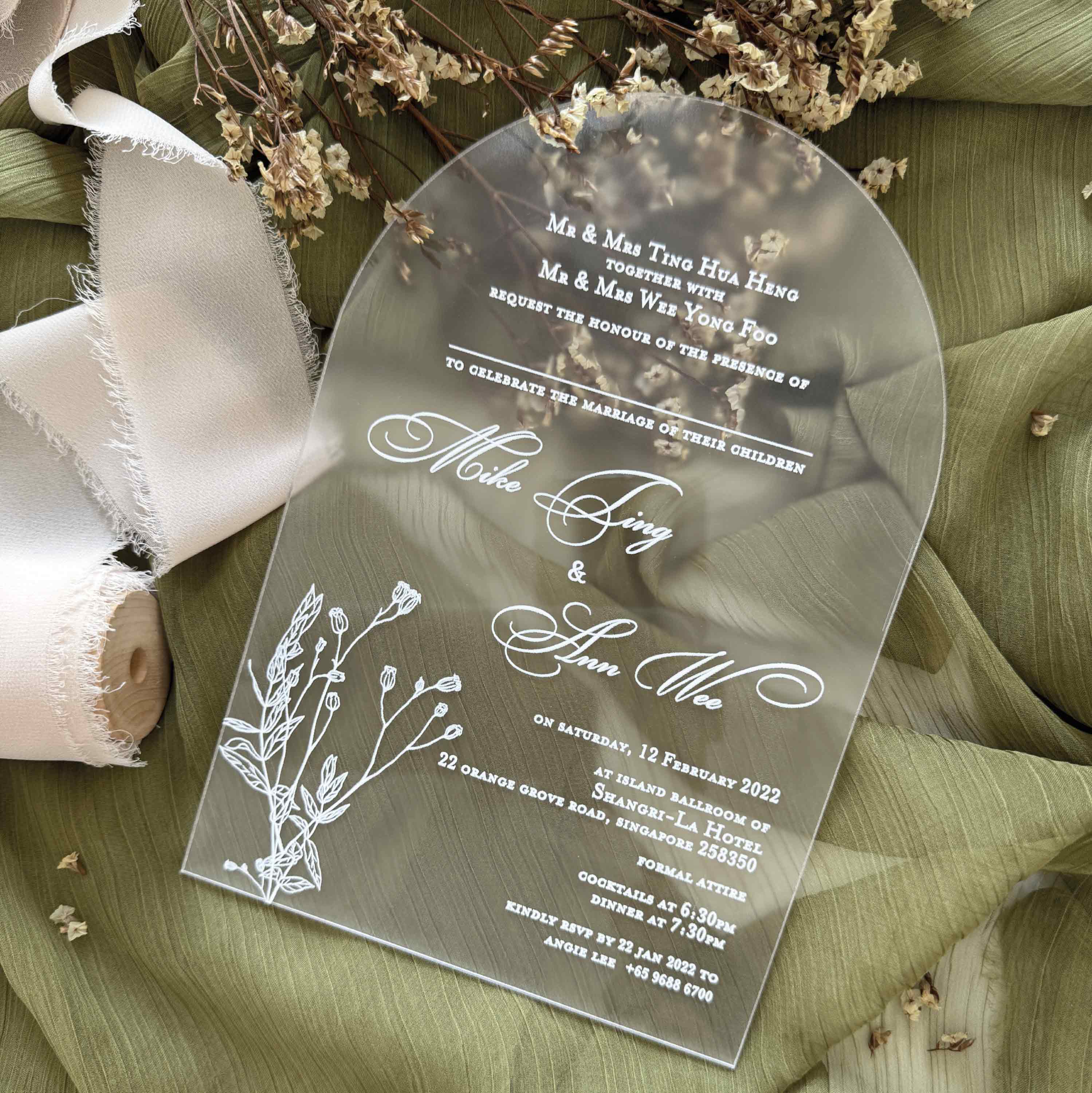 Frosted acrylic wedding invitation card with floral design printed in elegant white ink