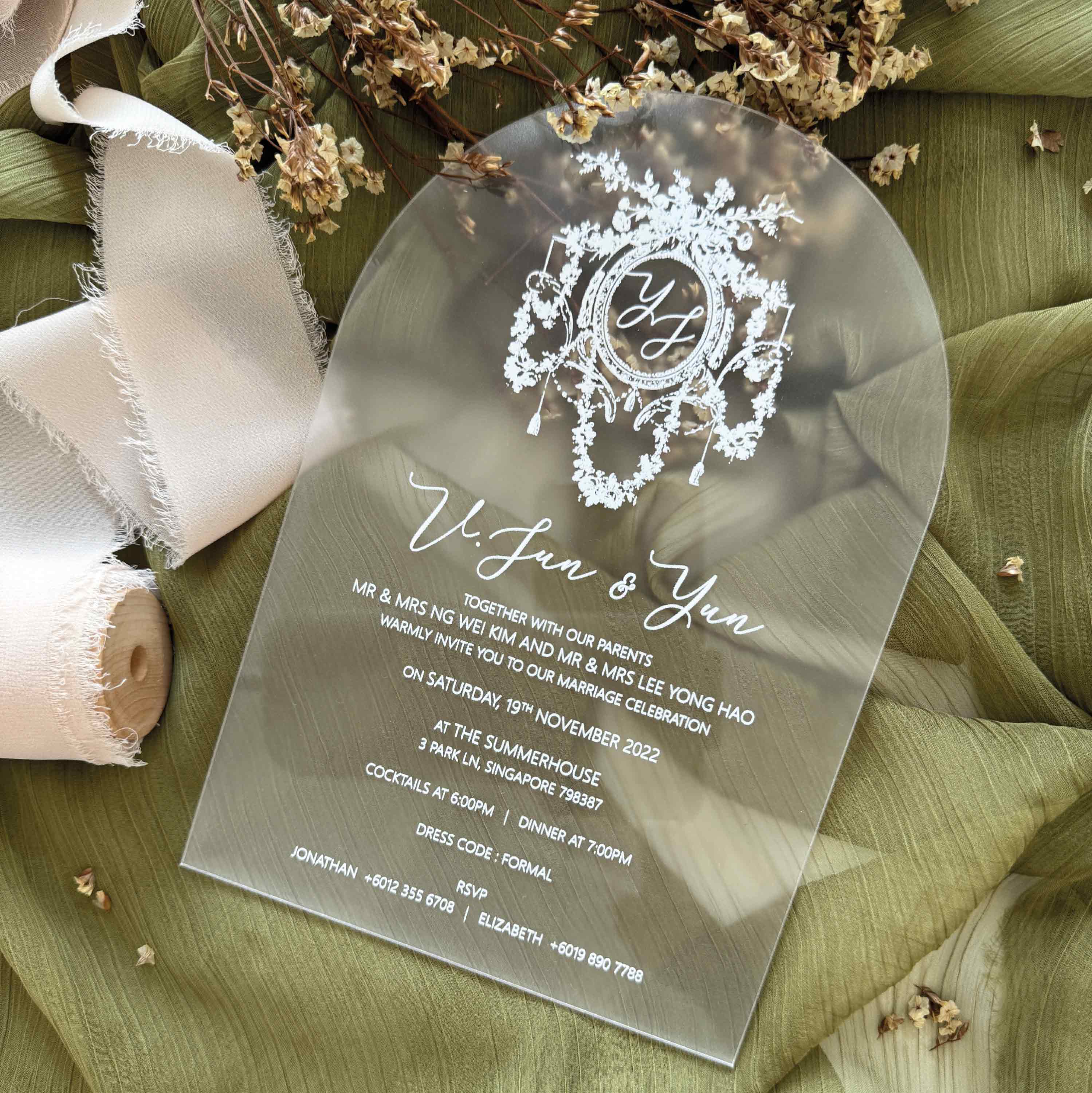 Wedding invitation card with decorative monogram design printed on arch shaped acrylic