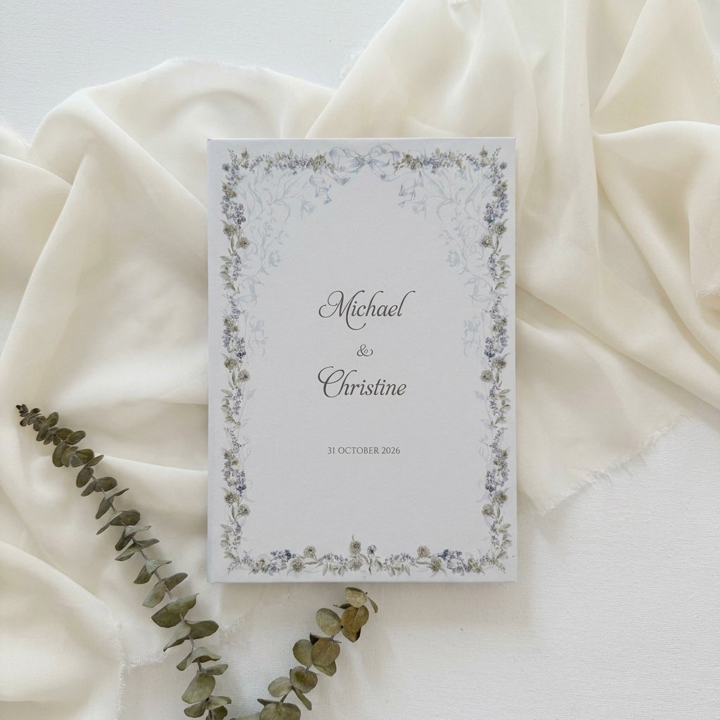 Hardcover wedding invitations offer a premium, book-like luxury presentation that makes a lasting statement for high-end ceremonies. Built on durable rigid chipboard, these invitations are often paired with high-end textures like matte laminate, velvet, or suede, and are finished with elegant hot foil stamping.