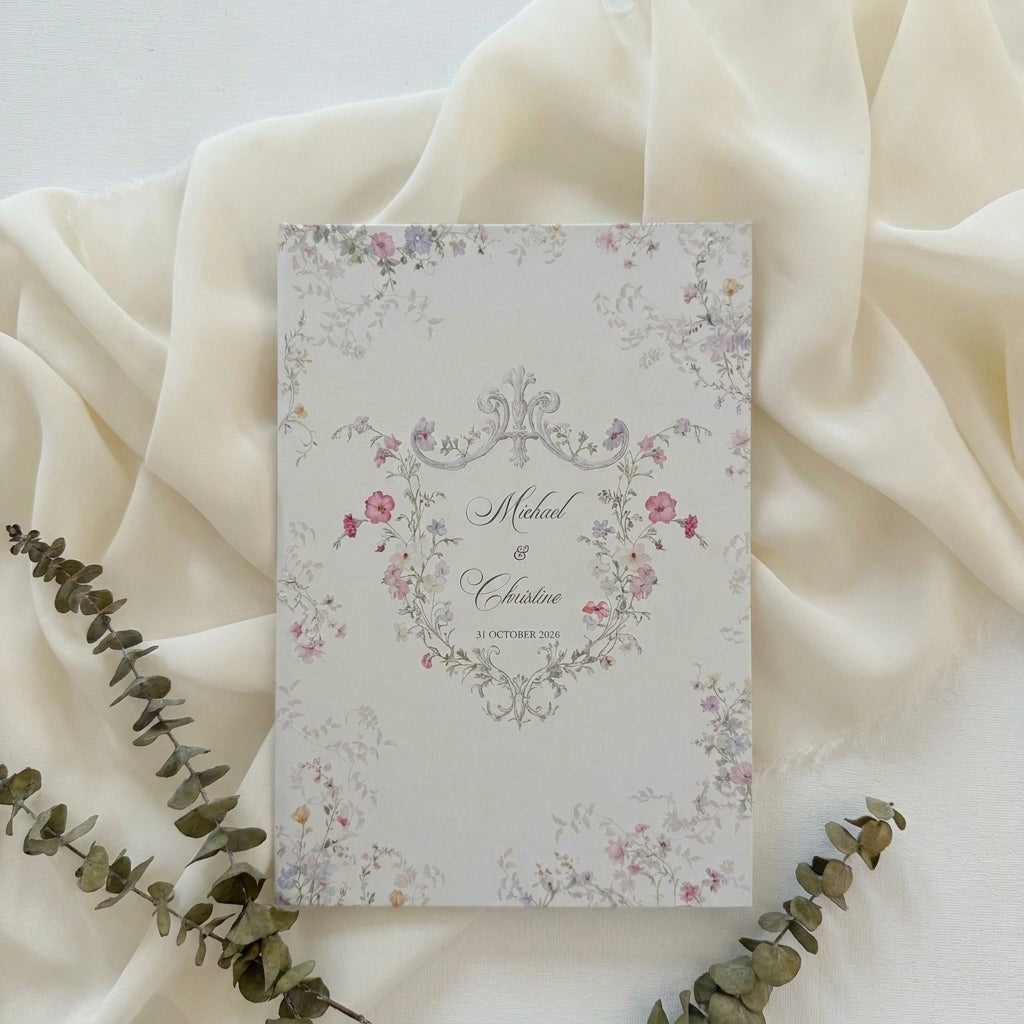 Hardcover wedding invitations offer a premium, book-like luxury presentation that makes a lasting statement for high-end ceremonies. Built on durable rigid chipboard, these invitations are often paired with high-end textures like matte laminate, velvet, or suede, and are finished with elegant hot foil stamping.