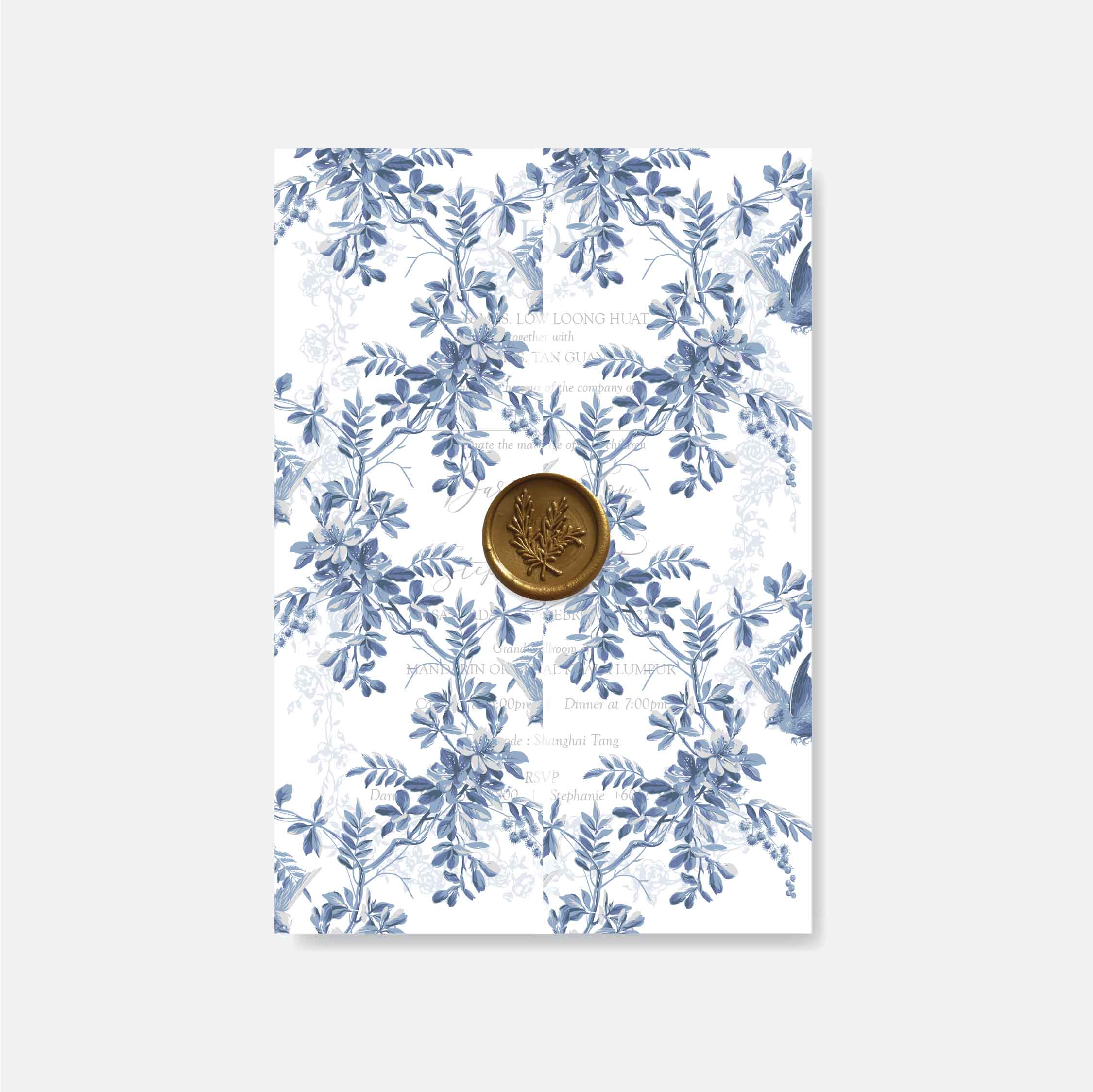 Vellum wedding invitation with blue floral pattern and a gold button wax seal on a white background