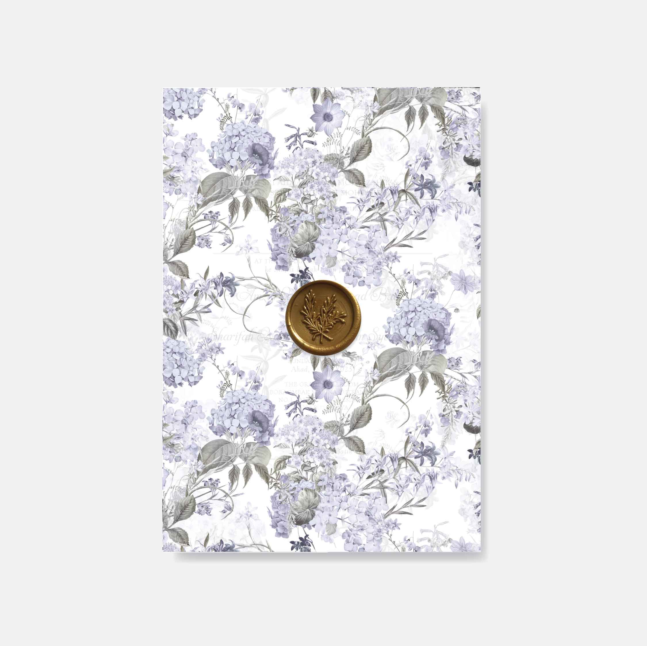 Floral patterned paper with a gold wax seal on a white background