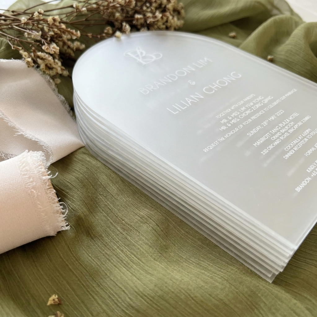 Stack of white cards with text on a green fabric background