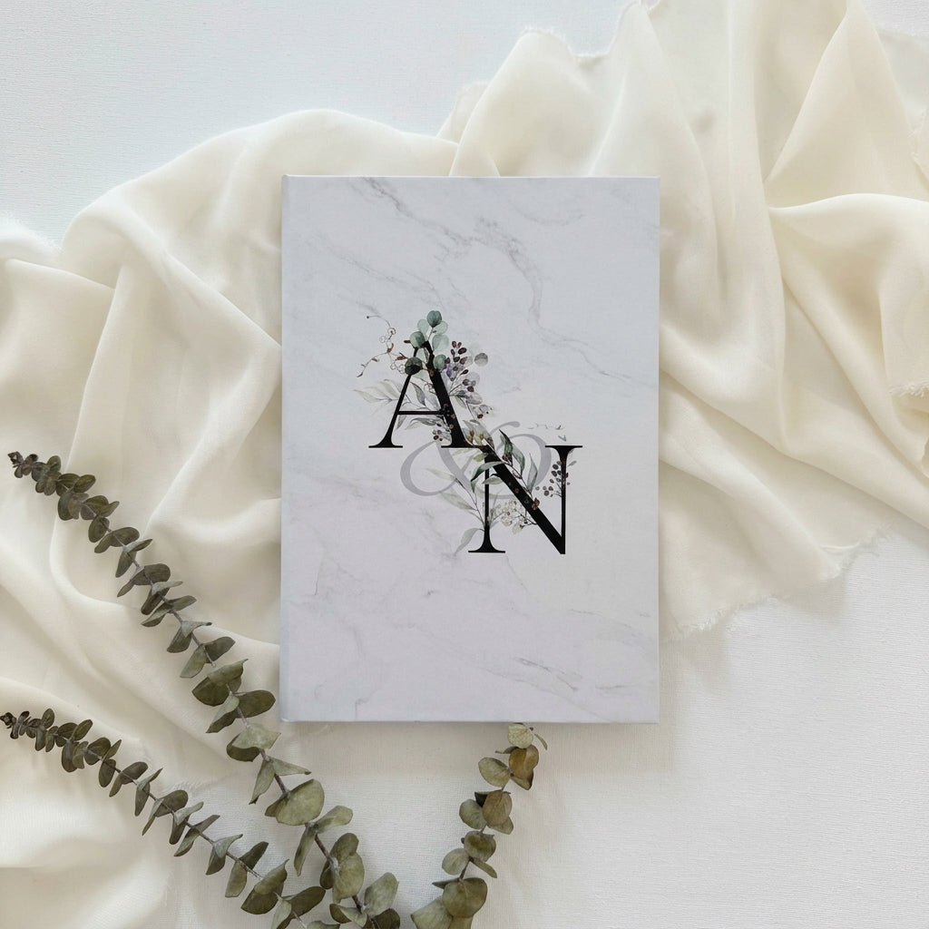 Hardcover wedding invitations offer a premium, book-like luxury presentation that makes a lasting statement for high-end ceremonies. Built on durable rigid chipboard, these invitations are often paired with high-end textures like matte laminate, velvet, or suede, and are finished with elegant hot foil stamping.