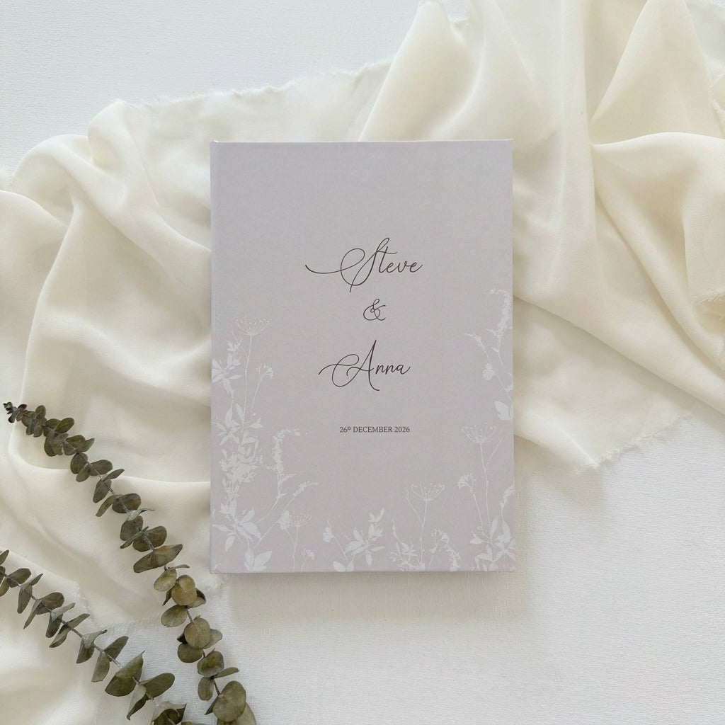 Hardcover wedding invitations offer a premium, book-like luxury presentation that makes a lasting statement for high-end ceremonies. Built on durable rigid chipboard, these invitations are often paired with high-end textures like matte laminate, velvet, or suede, and are finished with elegant hot foil stamping.