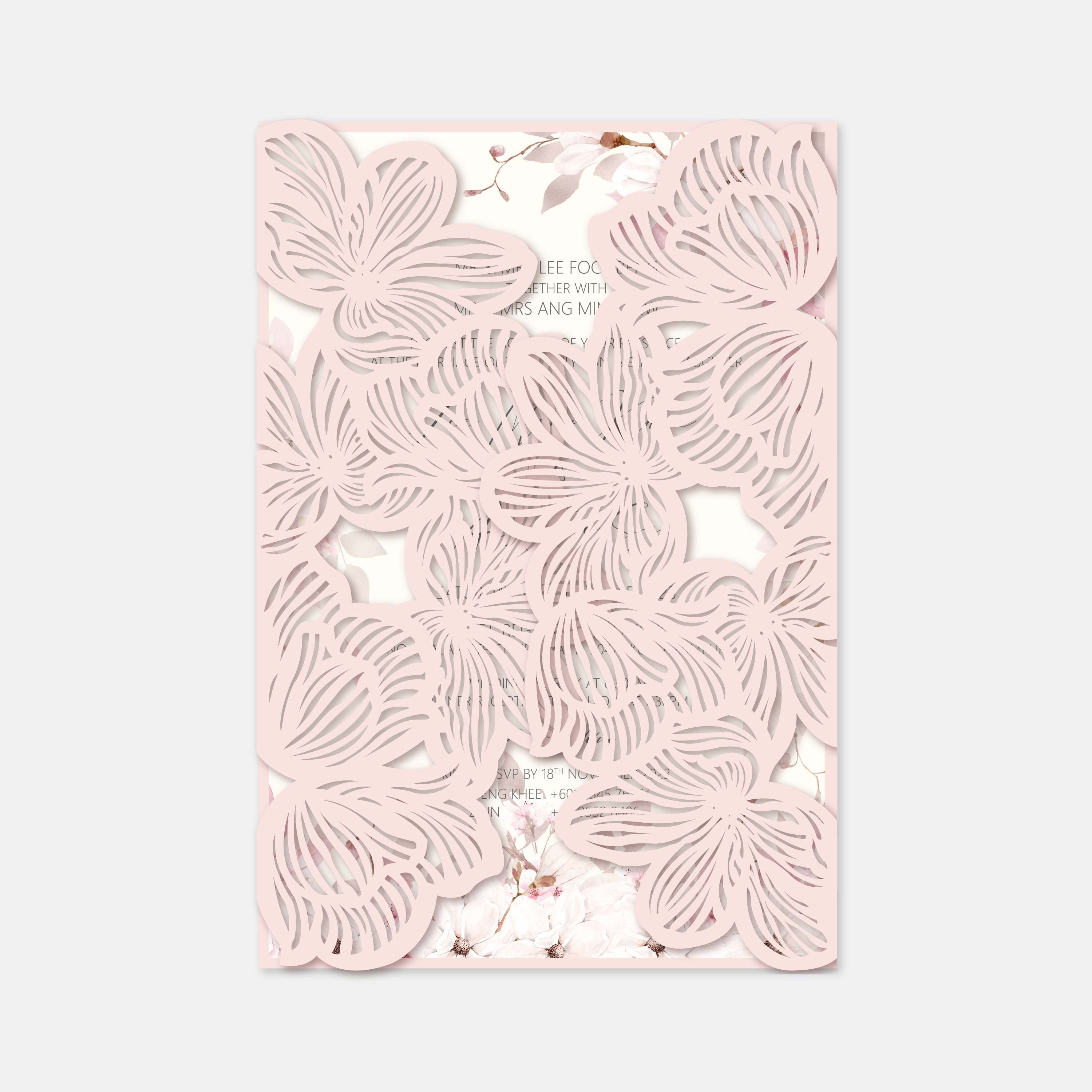 Decorative pink card with laser-cut floral patterns on a light gray background
