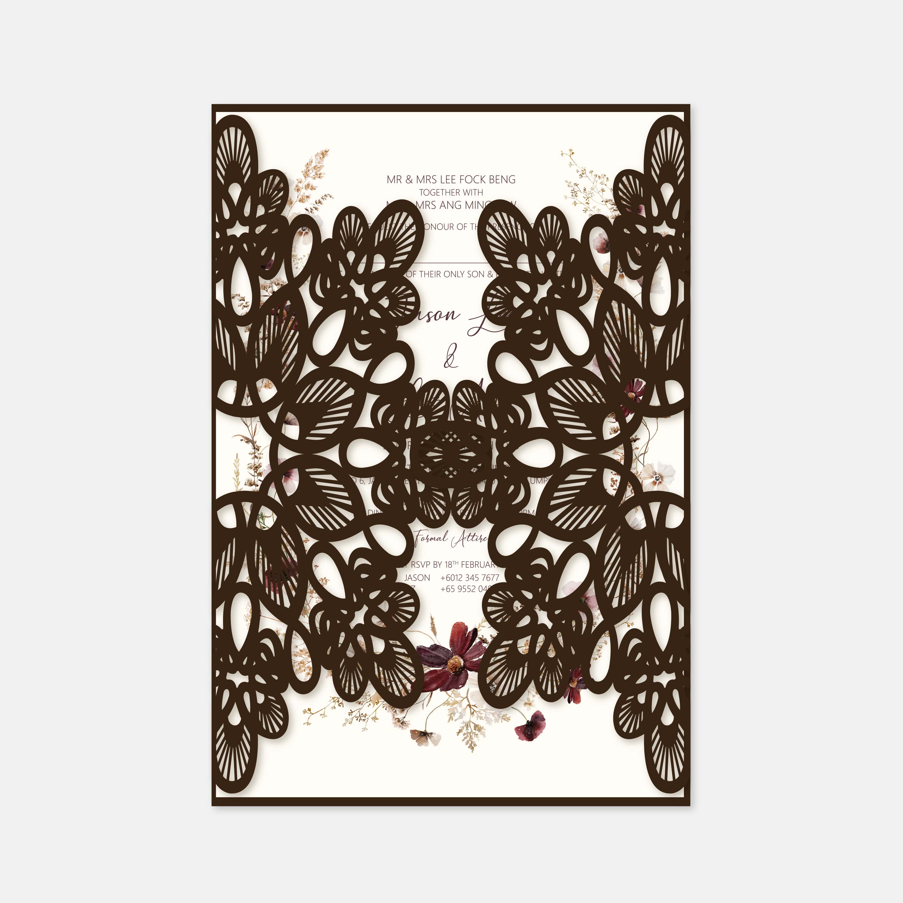 Laser-cut floral wedding invitation with intricate design on a white background