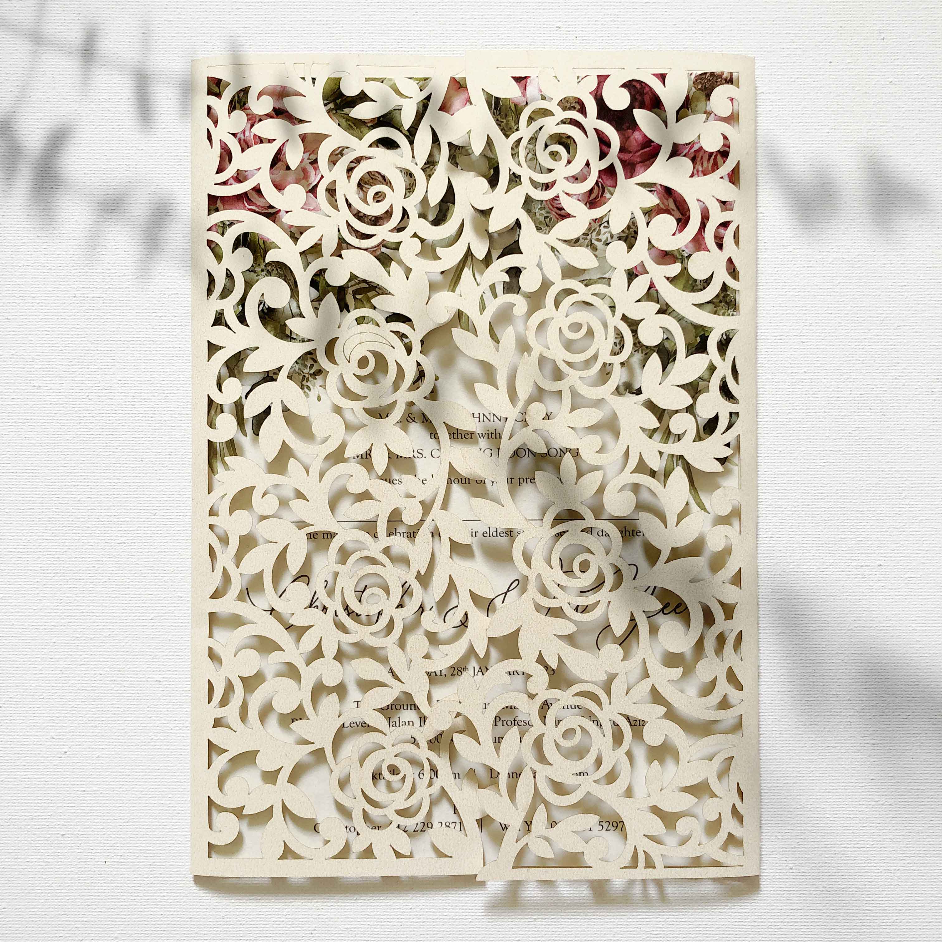 Decorative book with laser-cut floral design on a white background
