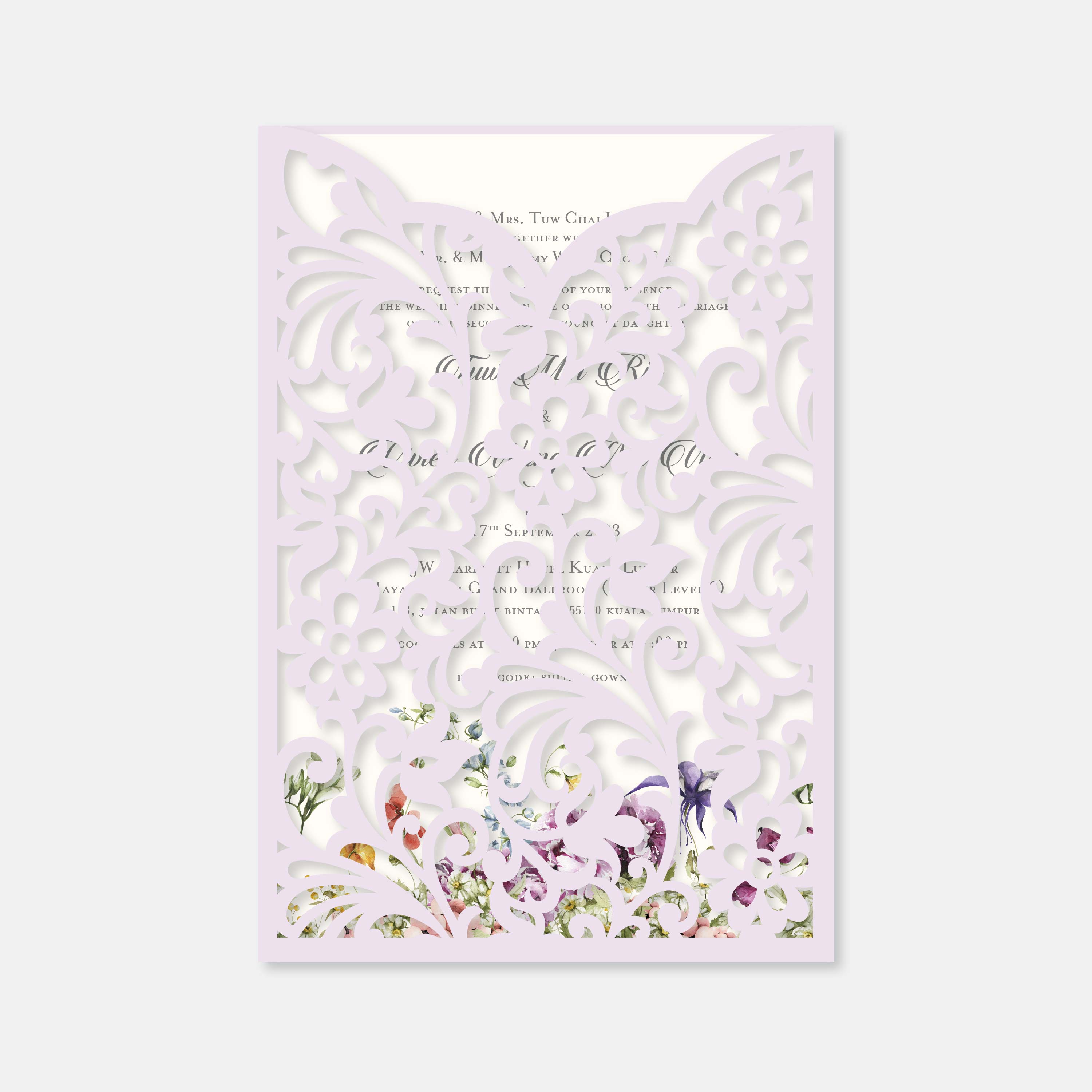 Decorative card with floral design and intricate cut-out patterns on a light purple background